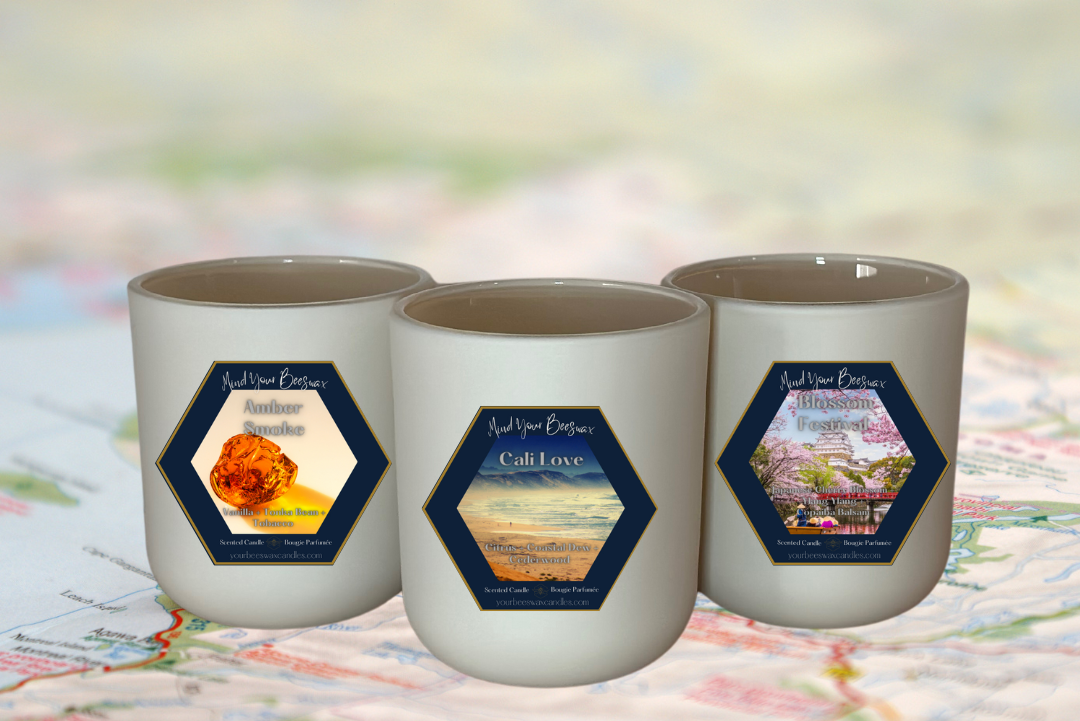 A visual representation of the Travel Collection Volume 1. The image showcases a collection of elegantly designed candles, hinting at the essence of different travel destinations through their labels and colors