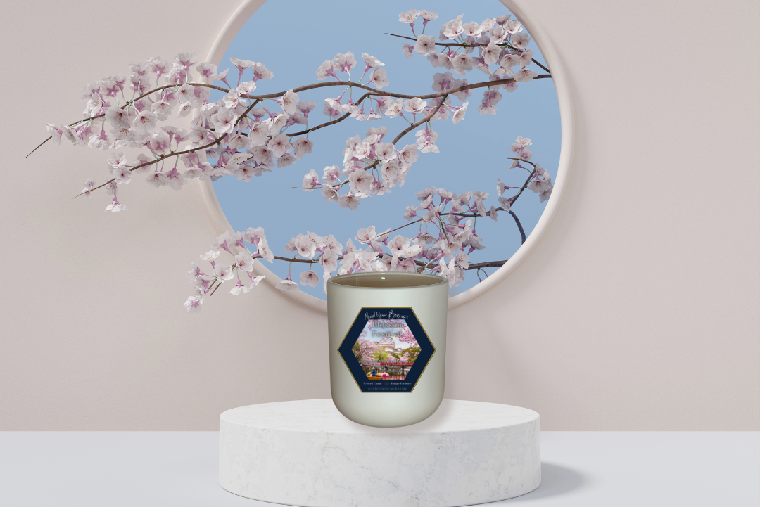 An elegant depiction of the Blossom Festival Luxury Beeswax Candle. The candle features a label displaying the scent name, and its warm glow enhances the atmosphere, evoking the essence of a blooming garden.